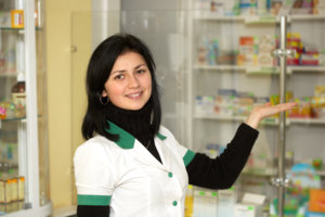 pharmacist woman standing in pharmacy